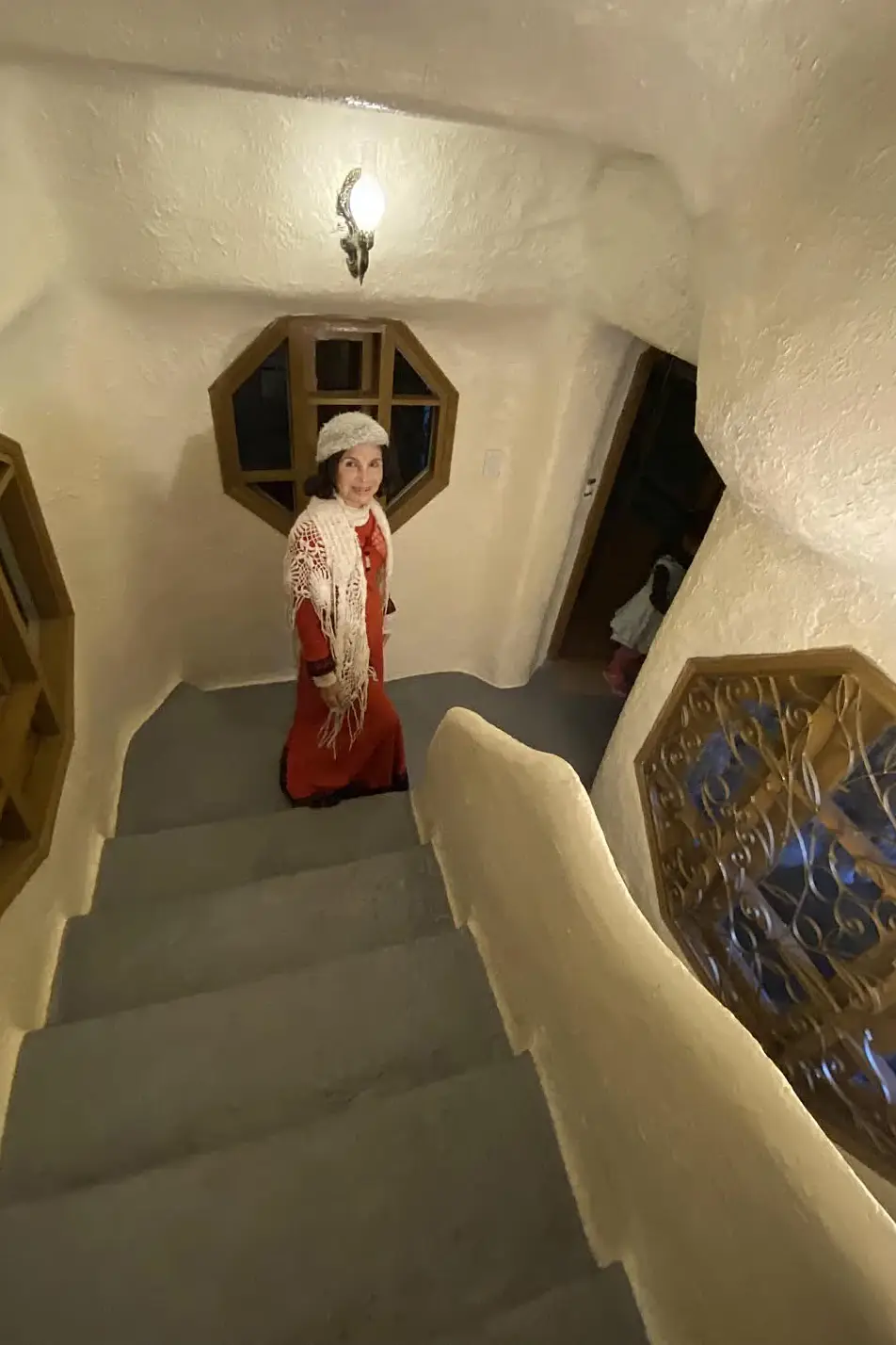 Đặng Việt Nga on a staircase in her house. Photograph published in 2022.