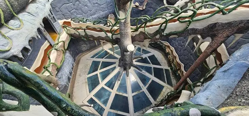 A view down onto the walkways and glass roof inside Crazy House.